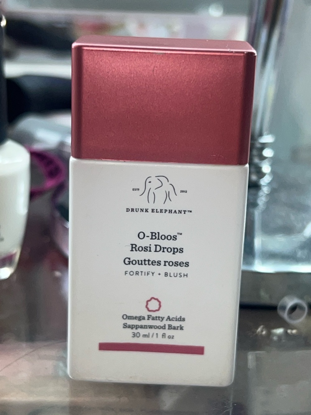 Drunk Elephant Coral Red and White Bottle